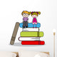 kids sitting on books