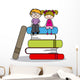 kids sitting on books