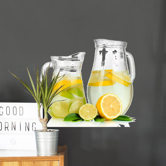 Cold water with lime, lemon and ice in pitchers isolated