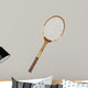Old wooden tennis racket isolated on white background