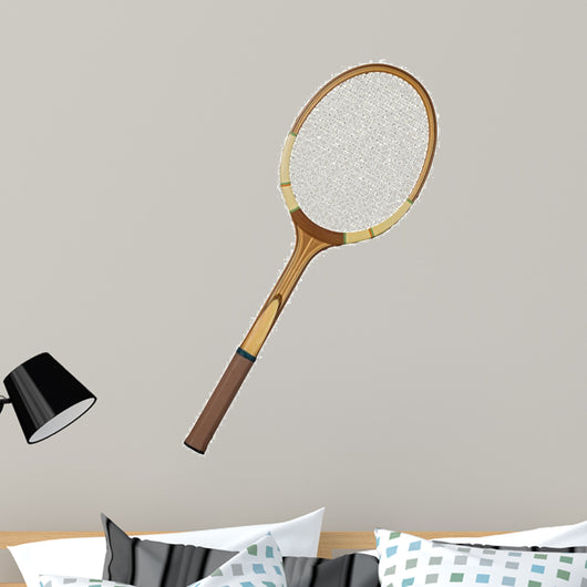 Old wooden tennis racket isolated on white background