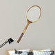 Old wooden tennis racket isolated on white background