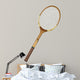 Old wooden tennis racket isolated on white background