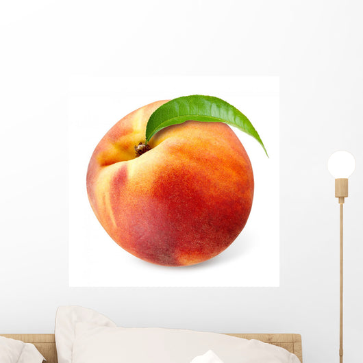 Peach with leaf isolated on white
