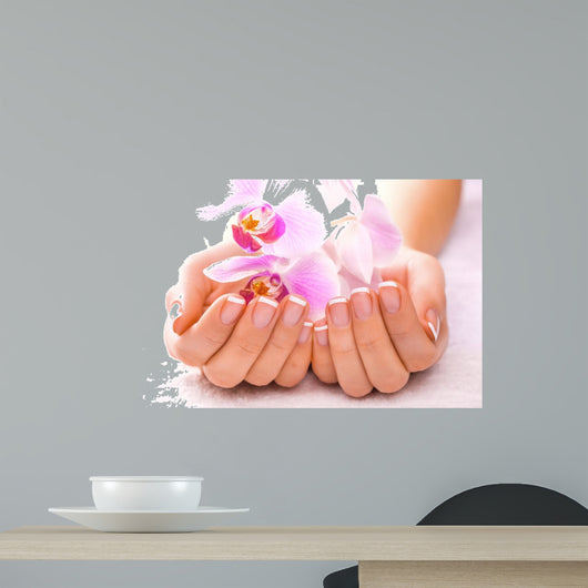 beautiful manicure with pink orchid on the white