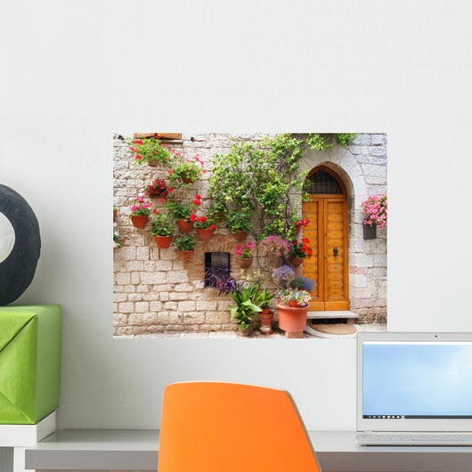 Colorful flowers outside a home in Assisi, Italy