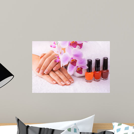 beautiful manicure with pink orchid on the white