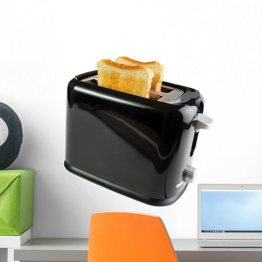 Black toaster with bread slices , isolated on white