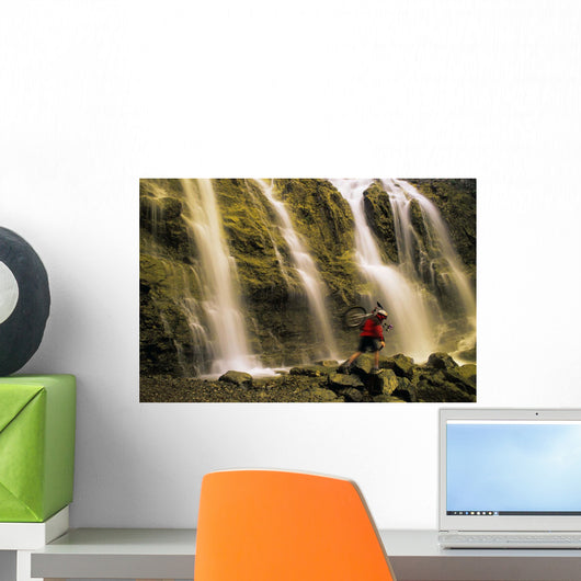 Time Delay Of Waterfall With Cyclist Carrying Bicycle Wall Mural