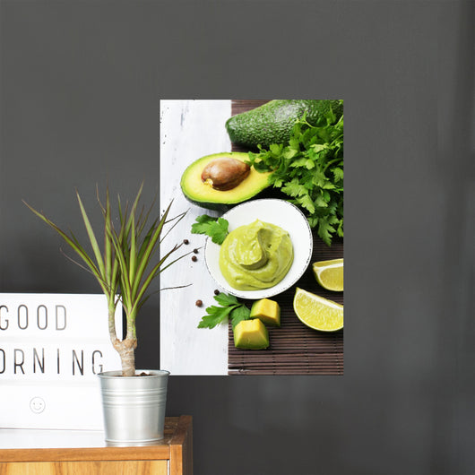Fresh guacamole in bowl on wooden table