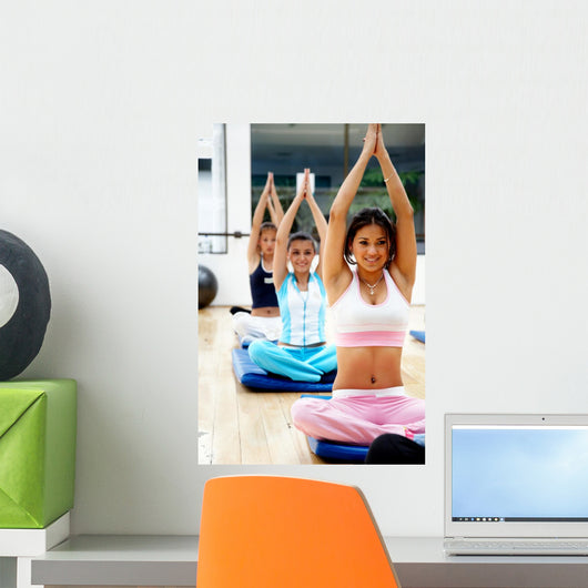 people at the gym taking a class smiling Wall Mural