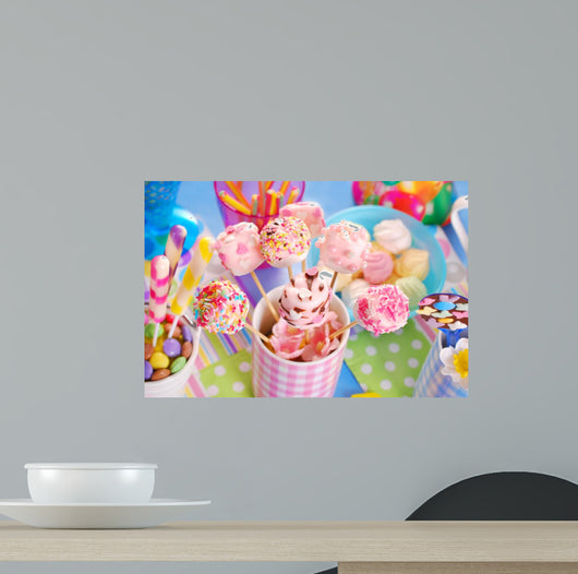 birthday party table with marshmallow pops and other sweets for