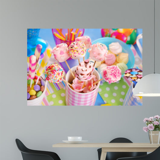 birthday party table with marshmallow pops and other sweets for