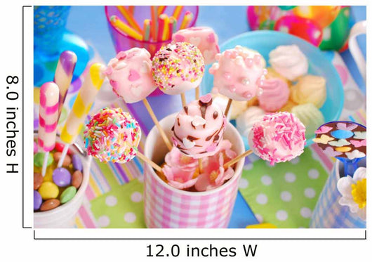 birthday party table with marshmallow pops and other sweets for
