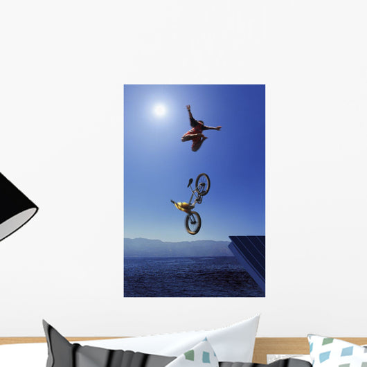 Cyclist Going Off Jump Into Water Wall Mural