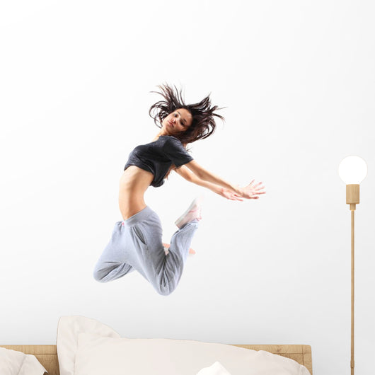 pretty modern slim hip-hop style teenage girl jumping dancing