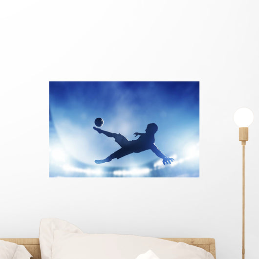 Football, soccer match. A player shooting on goal