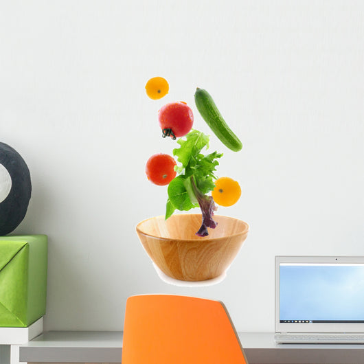Assorted fresh vegetables falling into a wooden salad bowl Wall Decal