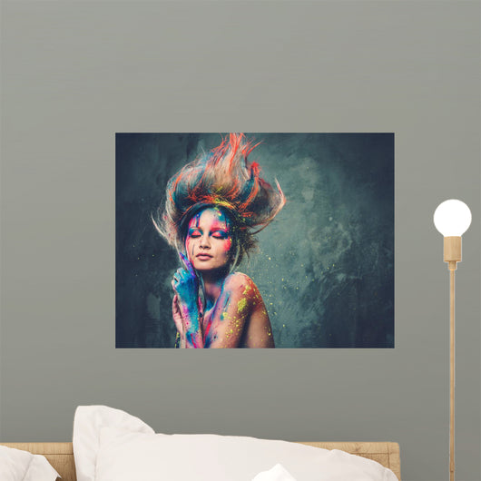 Young woman muse with creative body art and hairdo