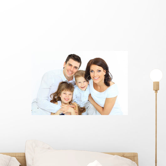 Beautiful happy family - isolated over a white background