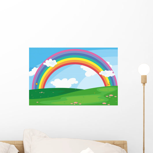 A green landscape with a rainbow in the sky Wall Mural