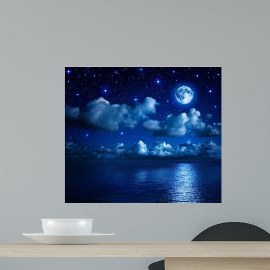 Super Moon in Starry Sky With Clouds