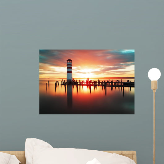 Beach sunrise with lighthouse