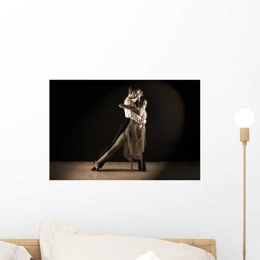 Latino dancers in ballroom against on black Wall Mural
