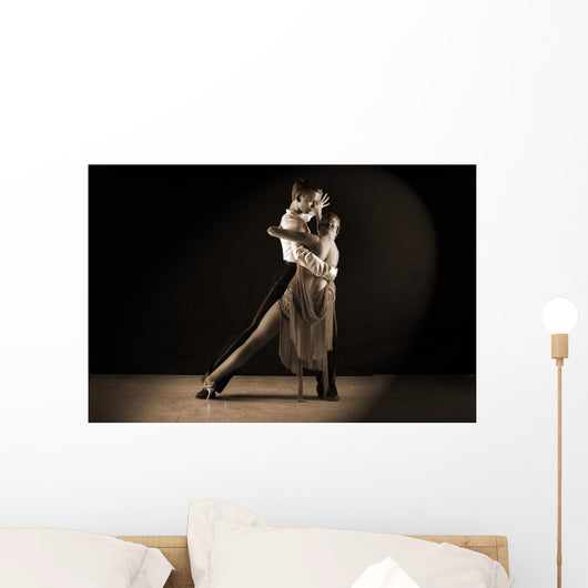 Latino dancers in ballroom against on black Wall Mural