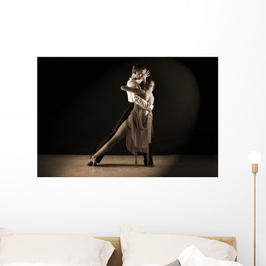 Latino dancers in ballroom against on black Wall Mural