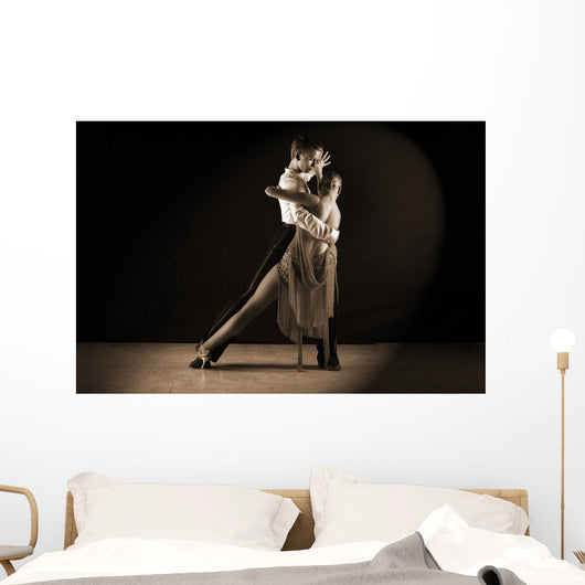 Latino dancers in ballroom against on black Wall Mural