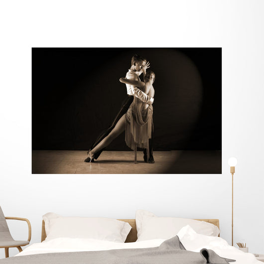 Latino dancers in ballroom against on black Wall Mural