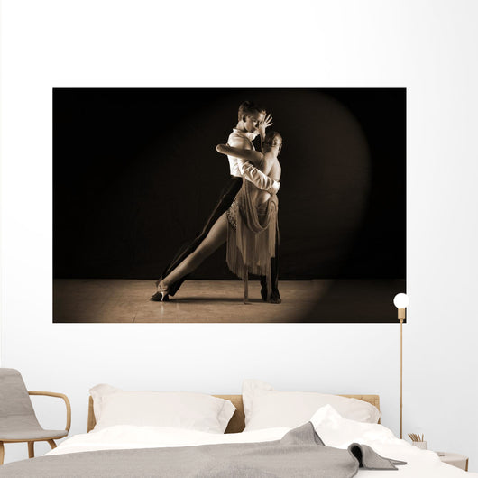Latino dancers in ballroom against on black Wall Mural