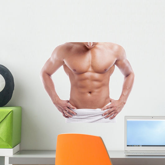 Muscular man in towel, isolated on white
