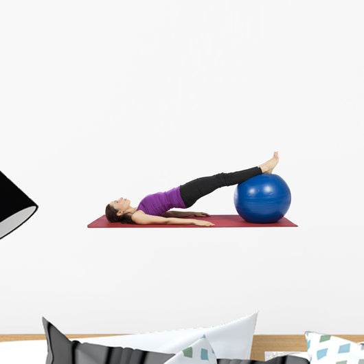 Young fitness woman working her abs with pilates ball Wall Decal
