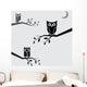 Vector image of an owls perched on branches Wall Decal