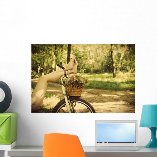 Legs on a bicycle Wall Mural