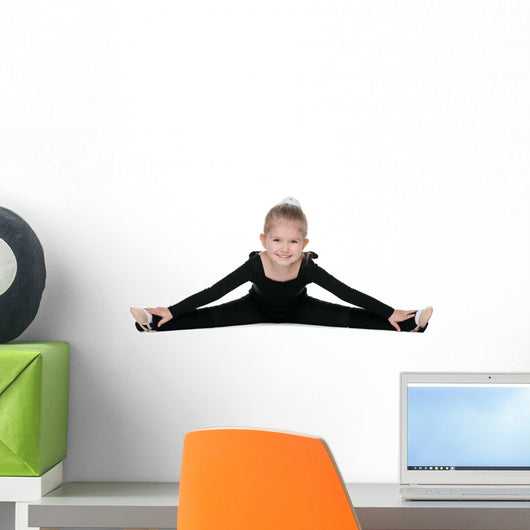 Pretty little girl performs gymnastic exercise Wall Decal
