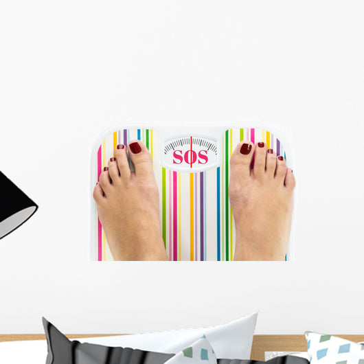 Feet on bathroom scale with word