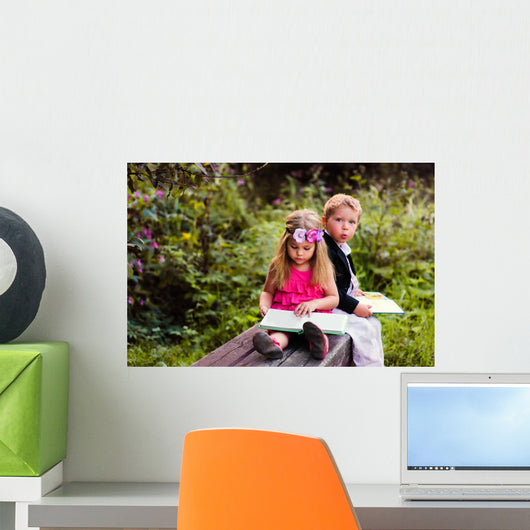 Little preschooler kid reading outdoor Wall Mural