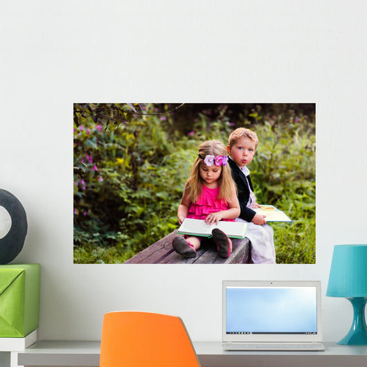 Little preschooler kid reading outdoor Wall Mural
