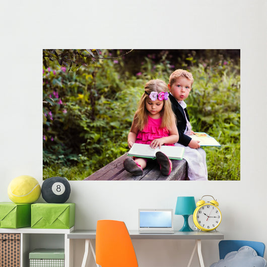 Little preschooler kid reading outdoor Wall Mural