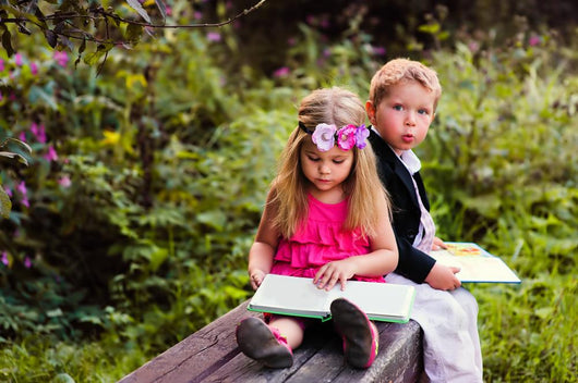 Little preschooler kid reading outdoor Wall Mural