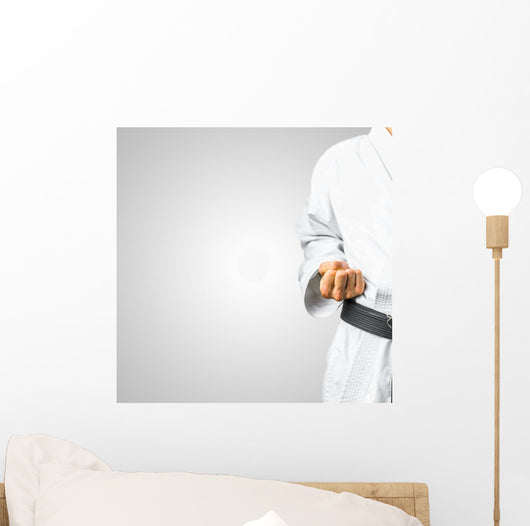 Partial view of a man in karate uniform Wall Mural
