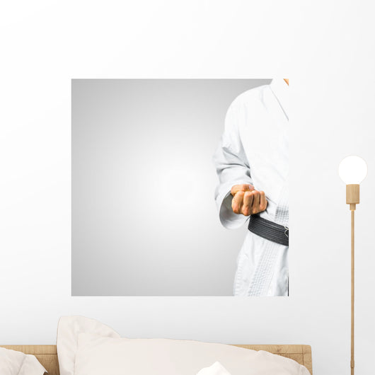 Partial view of a man in karate uniform Wall Mural