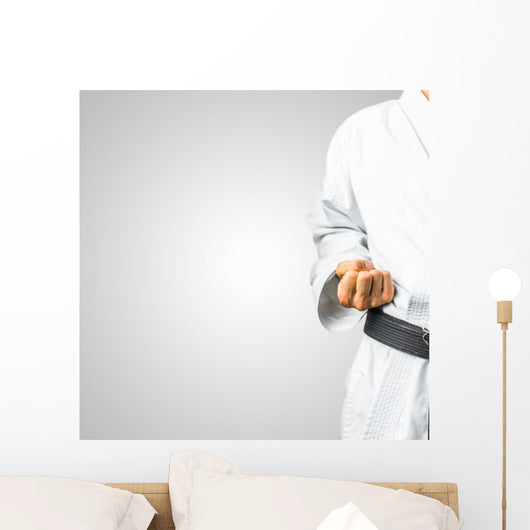 Partial view of a man in karate uniform Wall Mural