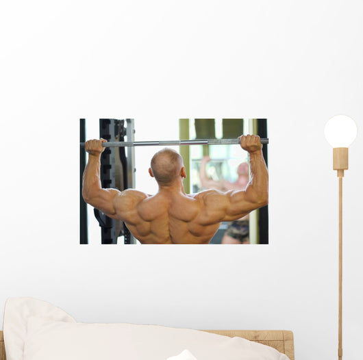Back Of Bodybuilder Raising Barbell In Gym Hall Before Mirror Wall Decal