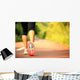 young fitness woman legs walking on forest trail  Wall Mural
