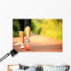 young fitness woman legs walking on forest trail  Wall Mural