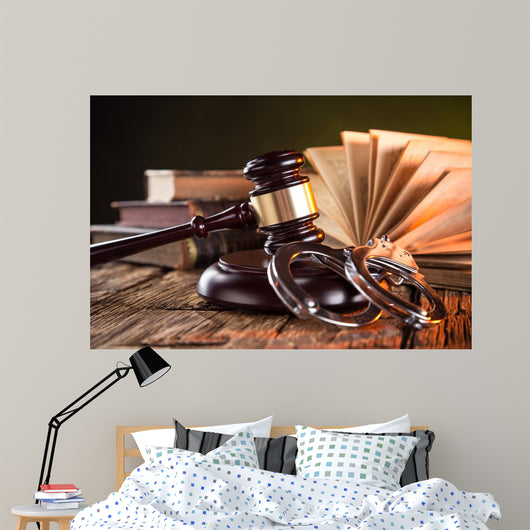 Wooden gavel and books on wooden table, law concept Wall Mural